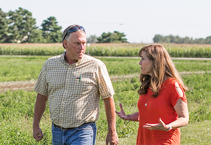 Theresa Gavarone speaking with a farmer